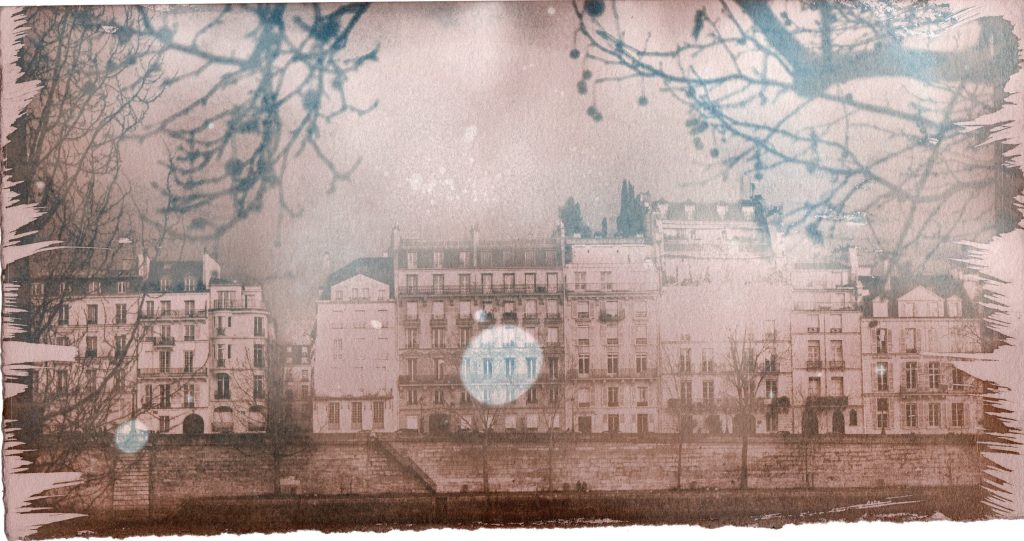 Soft pink-toned cityscape with bare branches and a pale circular reflection.