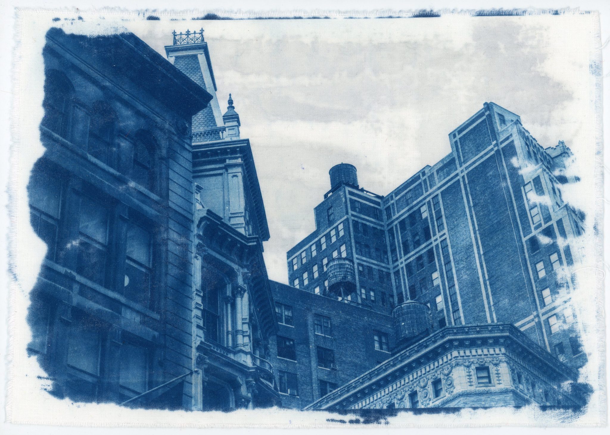 Blue-toned architectural print showing historic city buildings.